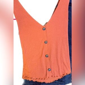 Coral tank top with buttons as detail- cute for your summer wardrobe this year!